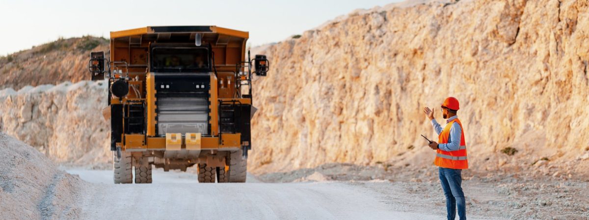 mining-engineer-directing-dumper-truck-in-open-pit-2025-10-19-16-26-39-utc (1)_11zon